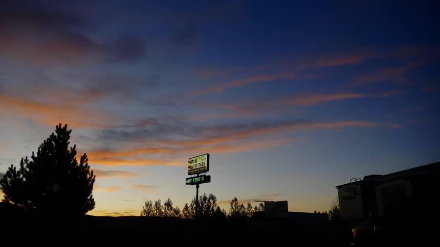 A silhouette of city at sunset