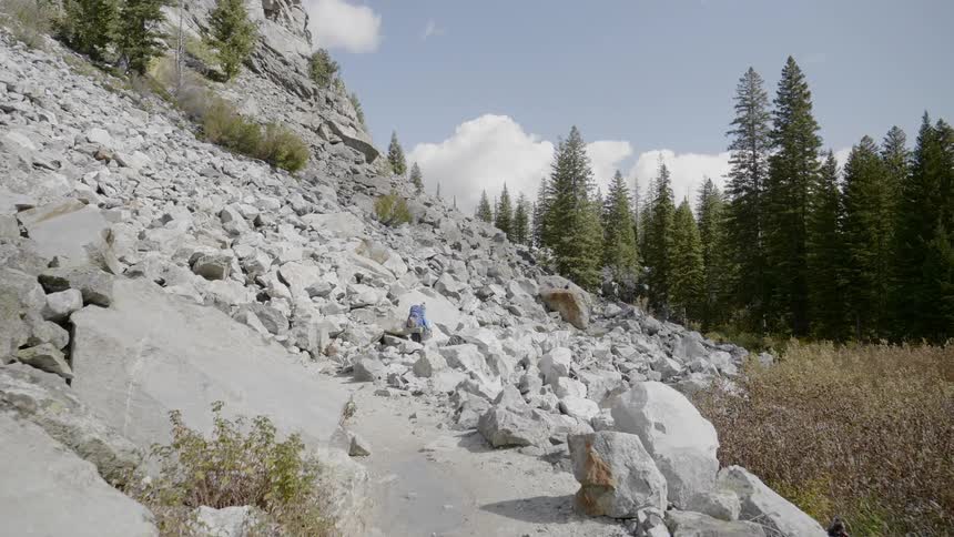 Man walk at rocky mountain