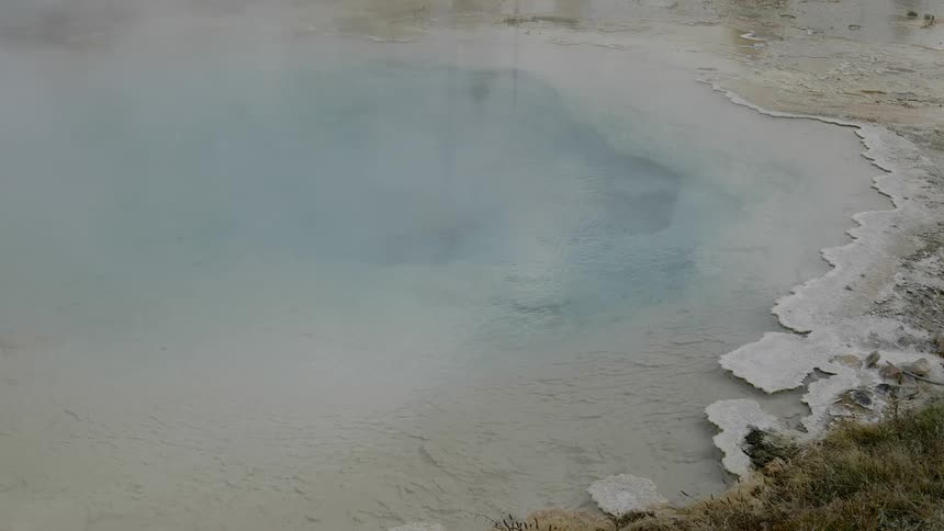 Steam rises from a natural spring