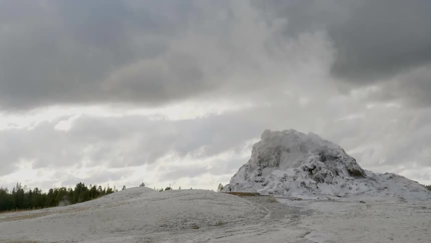 Dark clouds float over the snowy land