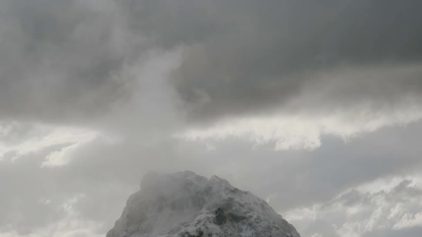 Clouds pour through the mountain