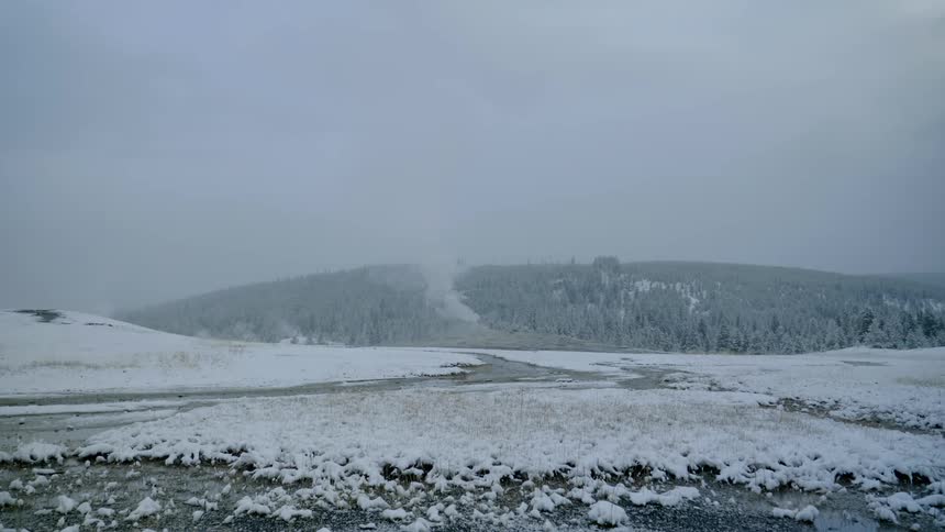 Smoking geyser in the snow