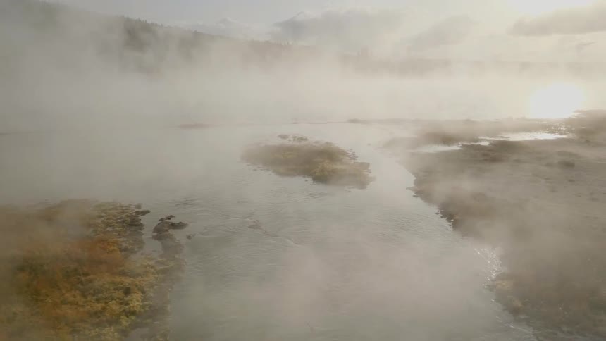 The steam rolls over the wilderness