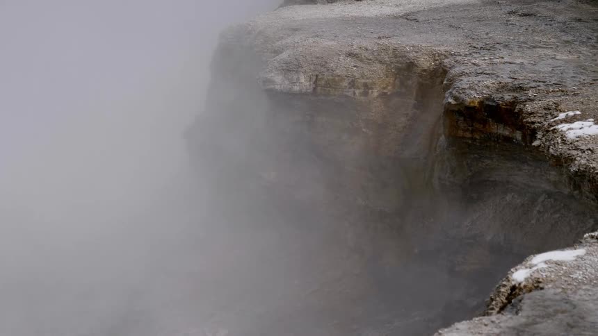 Mist is moving by the cliffs