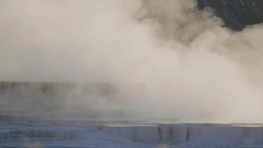 Steam flowing over uneven and rocky terrain