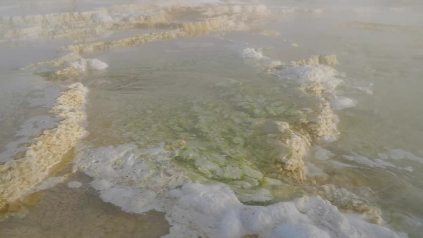 Natural hot spring water bubbling and steaming
