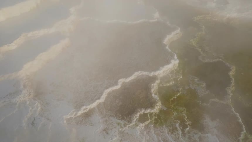 A geyser fills the sky with smoke