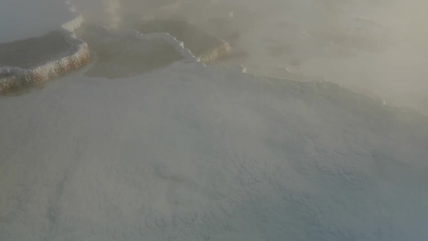 Birds eye view of water and ice over a lake