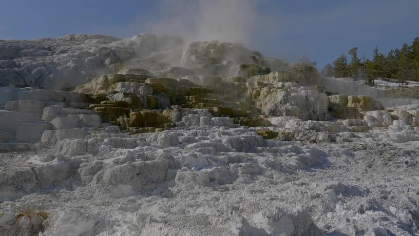 Smoke rises from the rocks