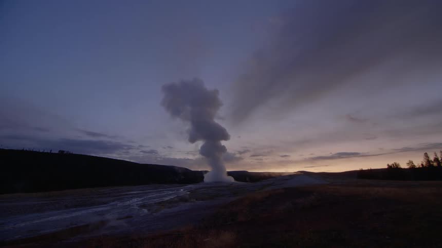 The steam is rising from the ground at sunset