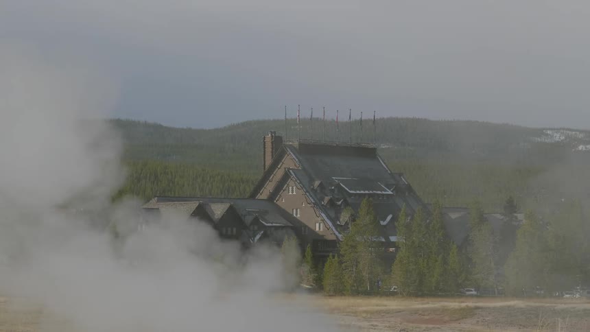 The steam rises on the field by the country home