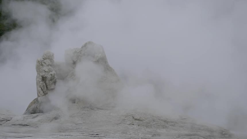 Steam rises up from a geyser
