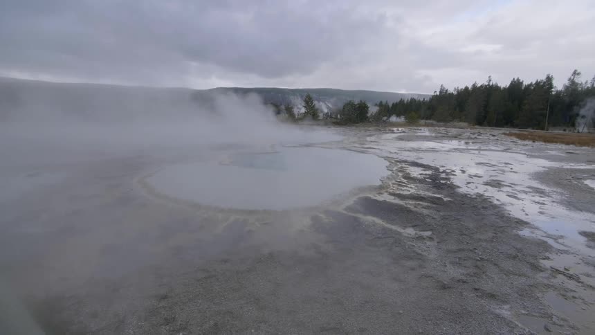Steam flows off of the geyser