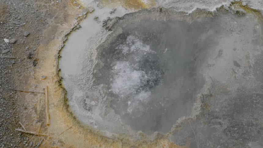 A bubbling nature hot spring during the day