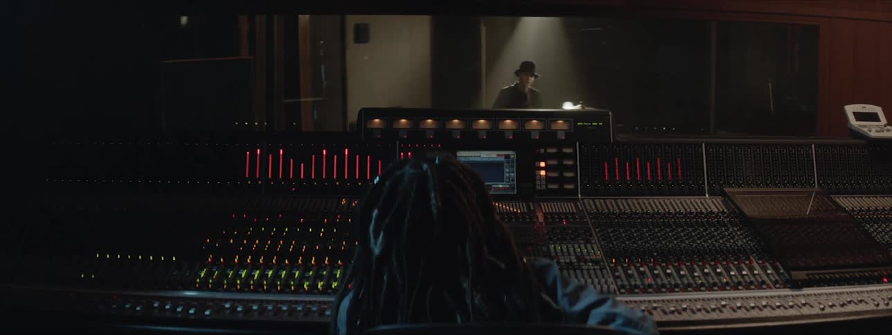 Musicians working at a recording studio
