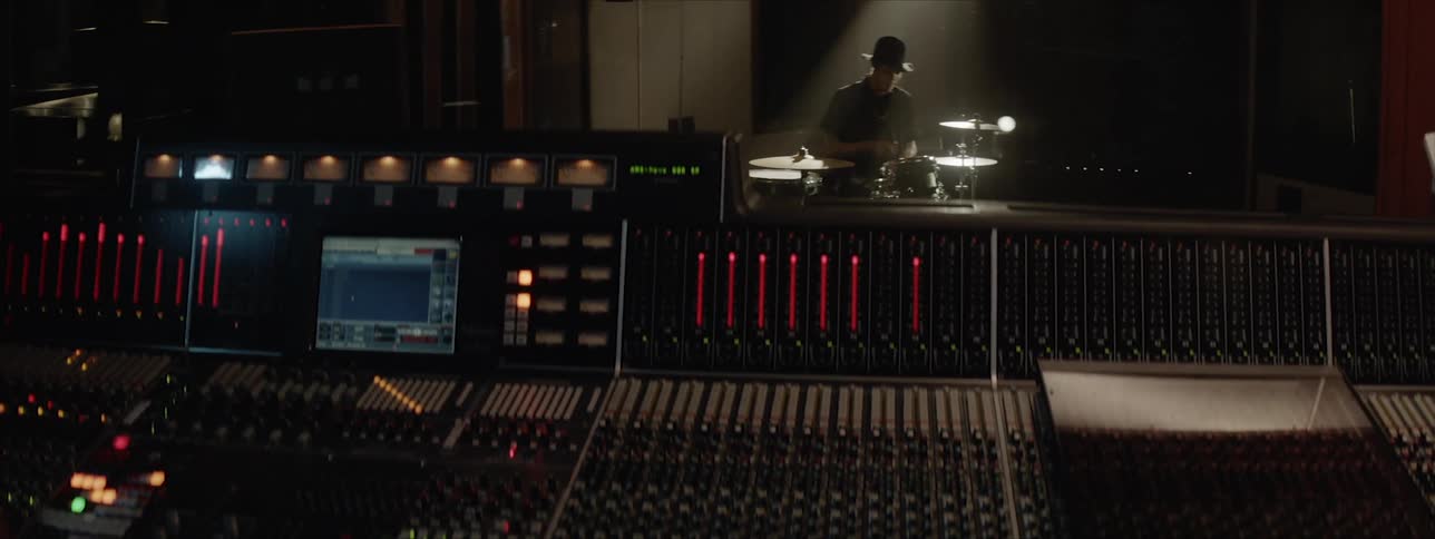 A person records another playing drums