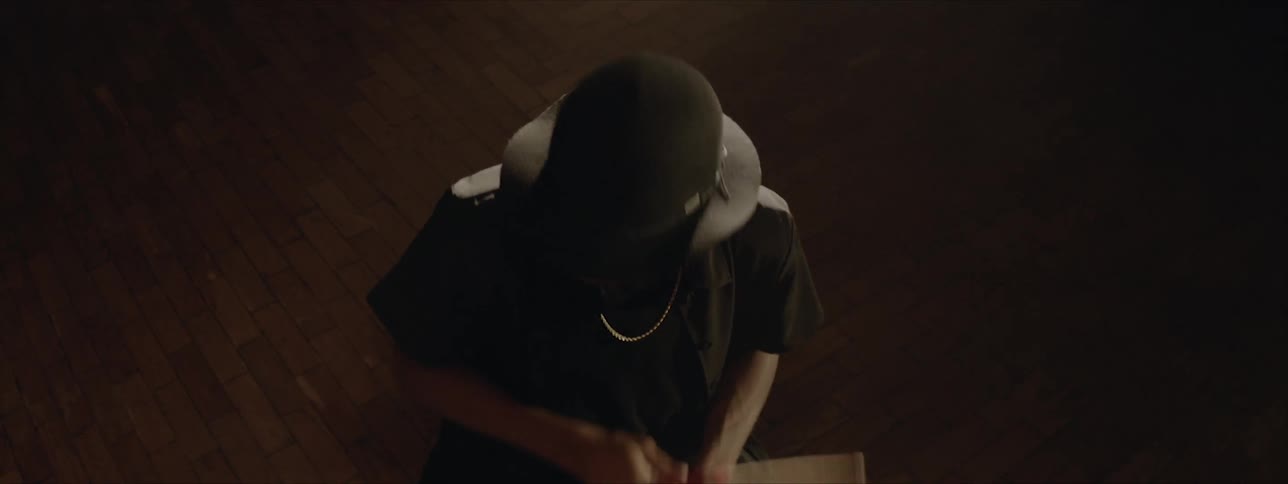 Birds eye view of a young man playing the drums