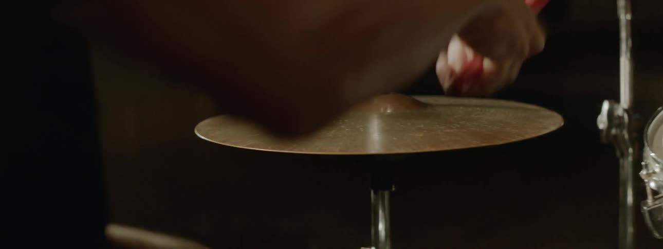 A person plays the drums