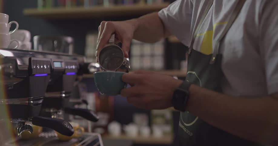 A barista making coffee at the cafe