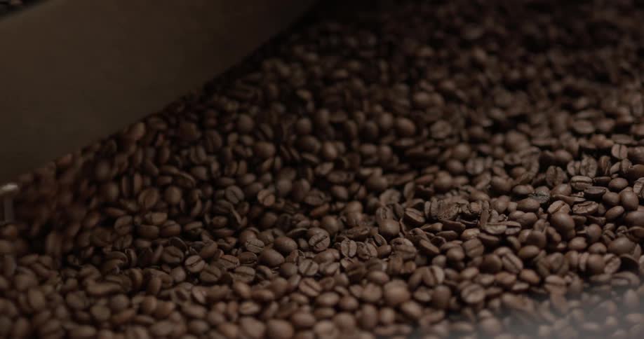 Coffee beans rotating in a mixing machine