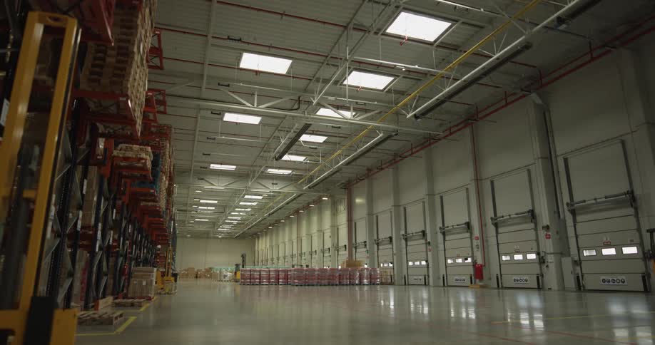 Lights illuminate the interior of the long narrow building