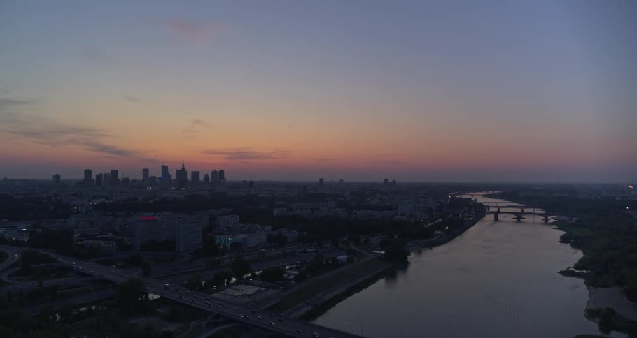 A river through a city at sunset
