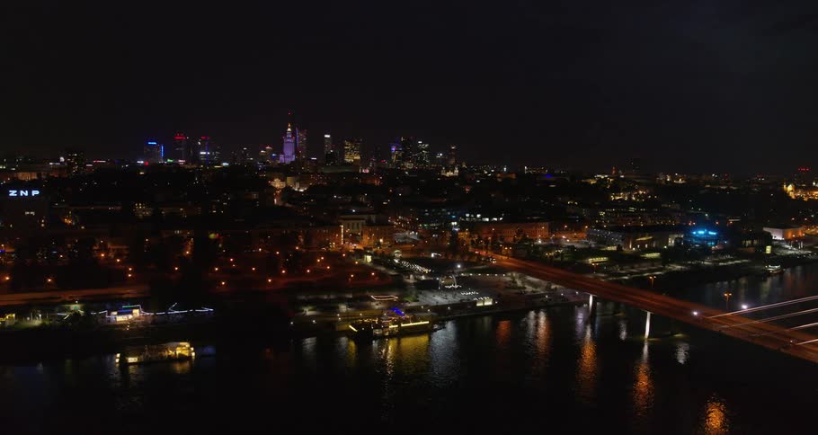 Skyline of the illuminated city with tall buildings at night