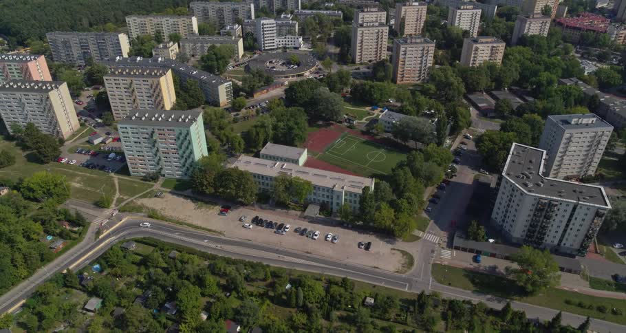 An aerial view of a downtown city is displayed