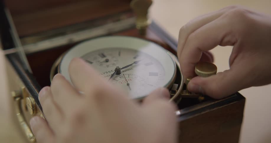 A person is fixing a clock