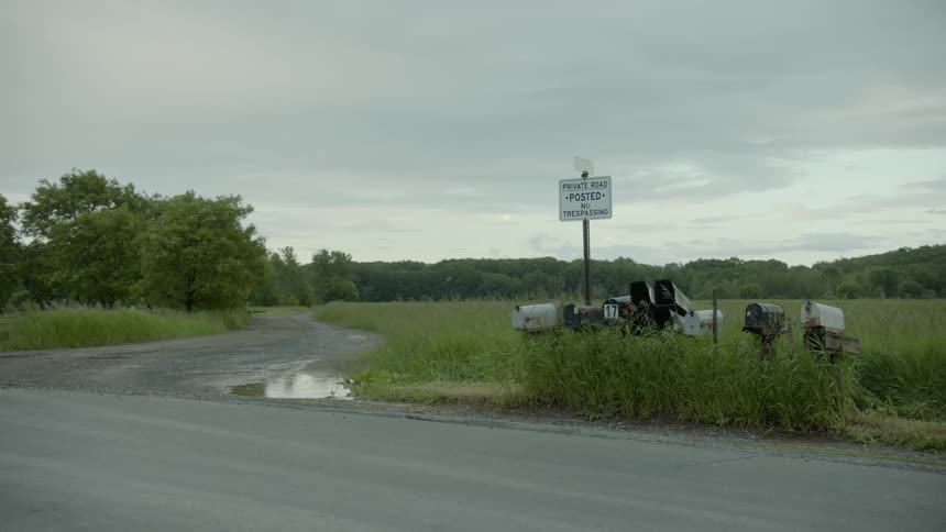 A private road with many mailboxes