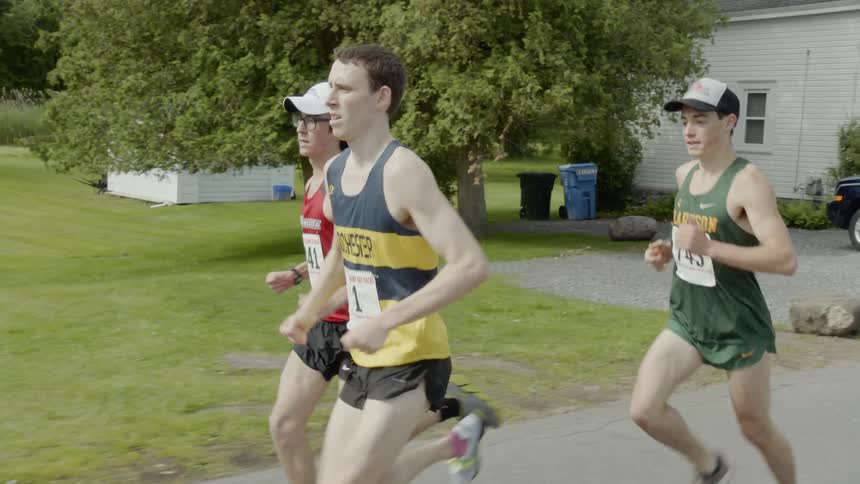 The three men race in the street together