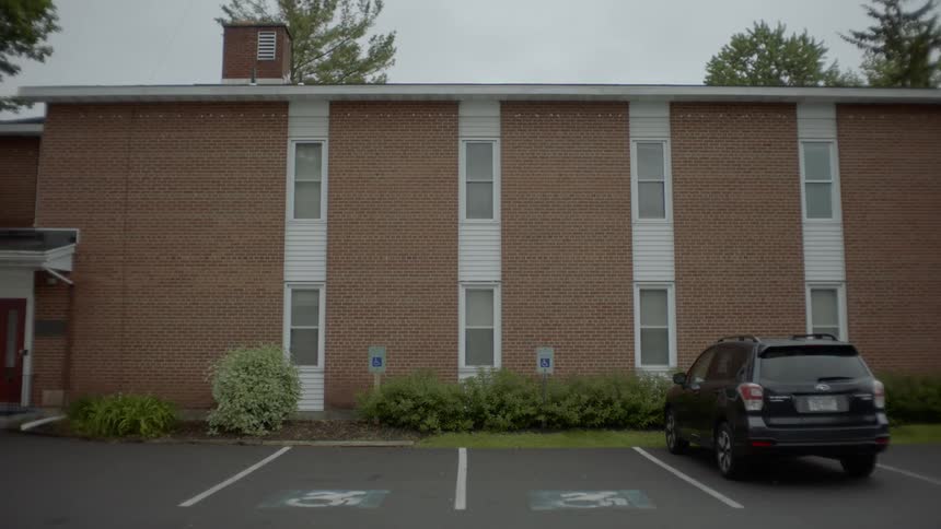A car parked outside a building