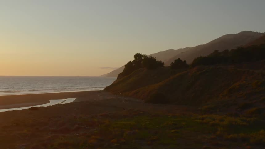 A hilly coastline in the evening
