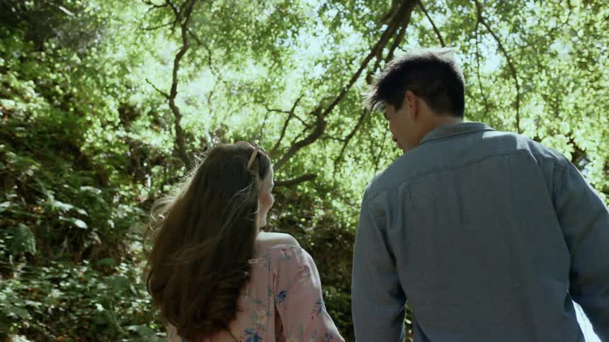 Couple walking in the woods