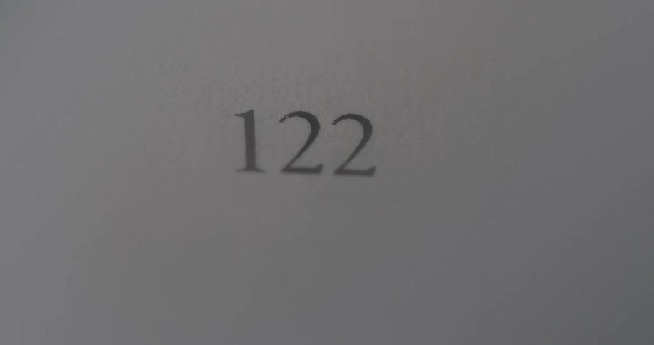 A number is blurred and comes into focus on a white piece of paper