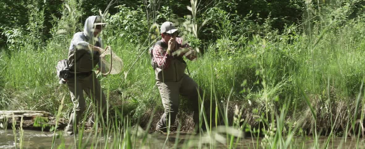 Two men fishing in a river
