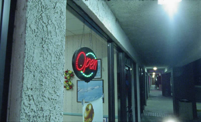 A person is walking by a store