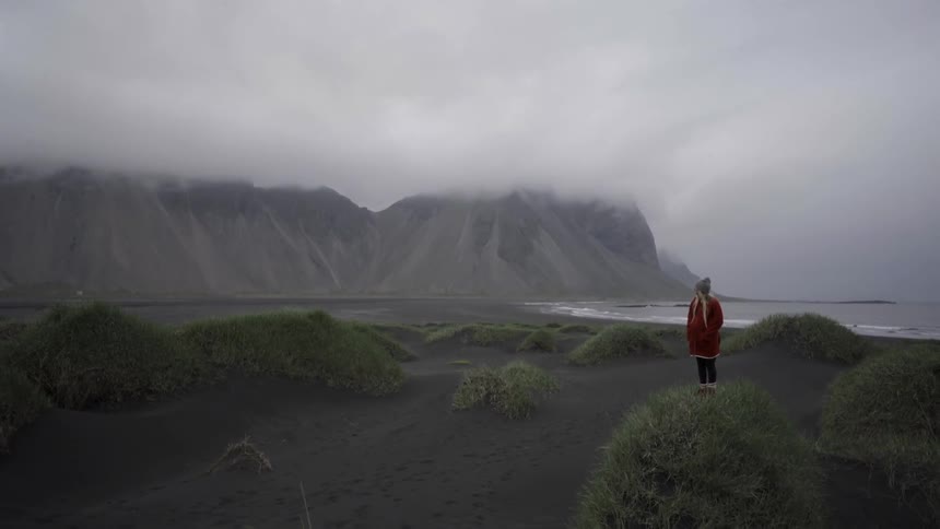 A person looking at a mountain