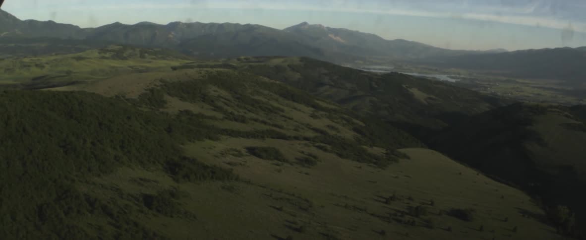Rolling hills sprawl ahead
