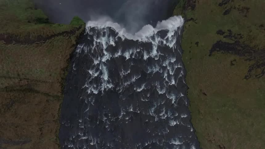 Overhead view of a waterfall and wide flowing river