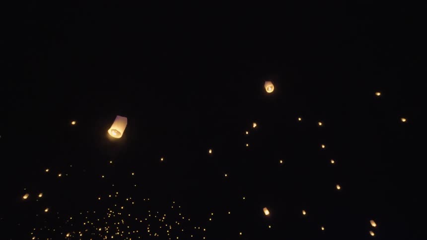 Flame lamps are floating into the night sky