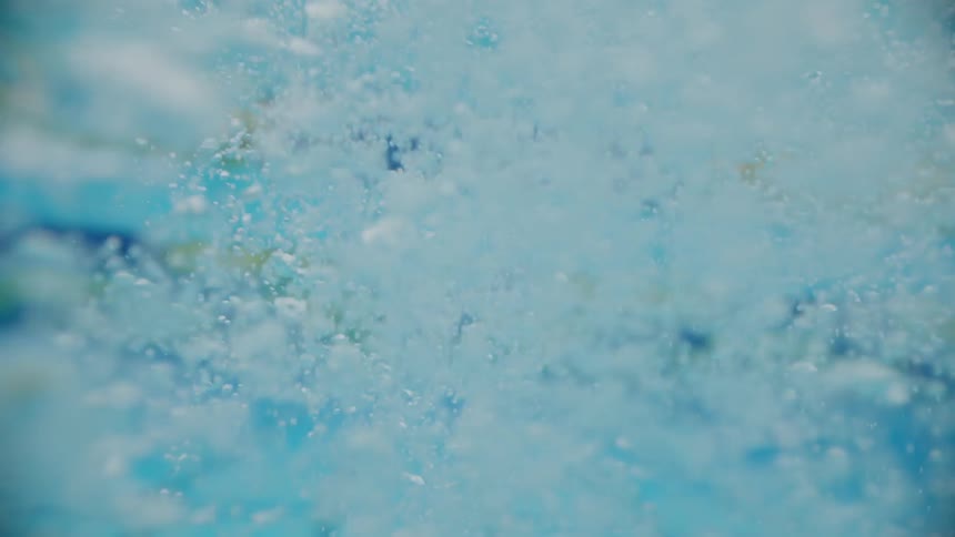 The bubbles slowly rise in the water