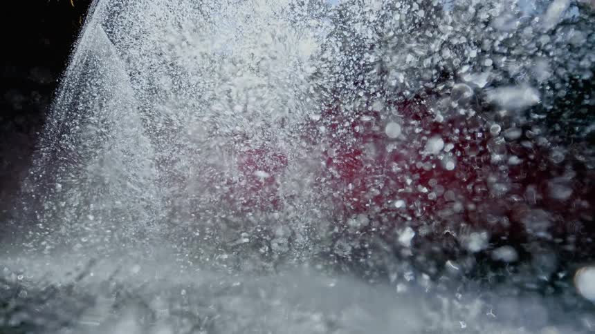 Water drops falling into water