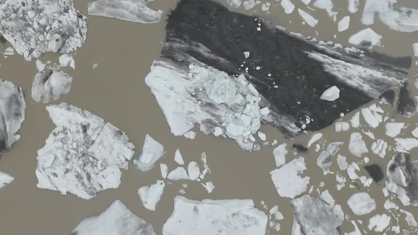 Aerial shot of ice blocks on the water