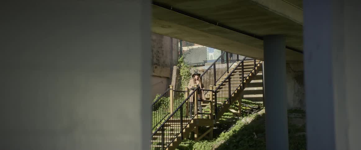 A person is walking down some stairs