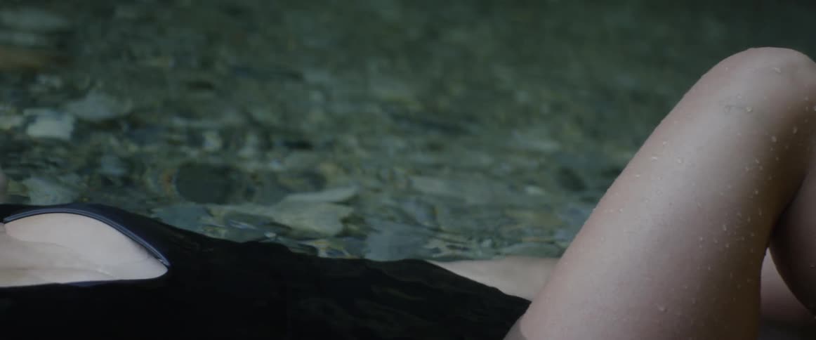 A woman is laying in the water