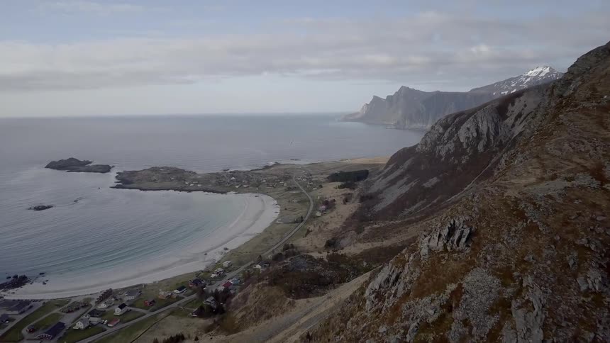 Aerial of the shoreline in a cove near cliffs