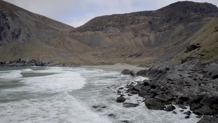 Waves splash towards the shoreline