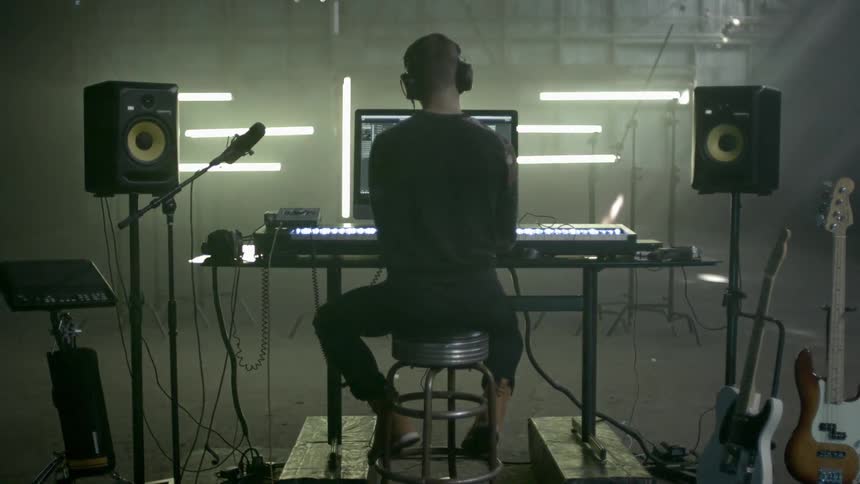 A young man plays on a keyboard