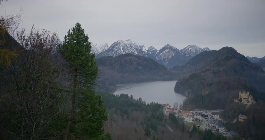A town close to a lake with mountains in the background
